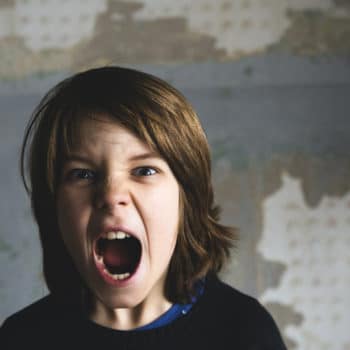 Boy screaming because he is angry