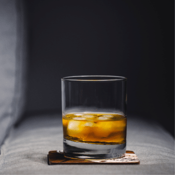 glass of alcohol in a dark room